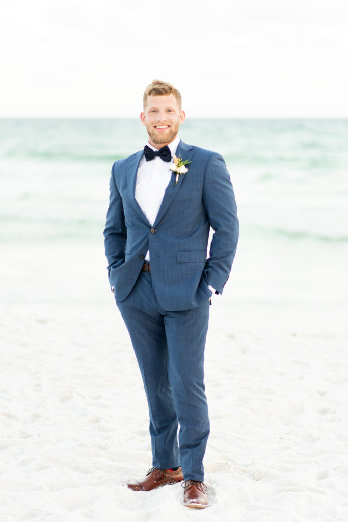 groom portrait on beach