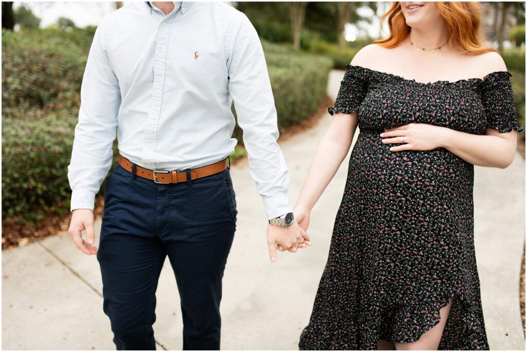 maternity session pensacola florida downtown park couple holding hands