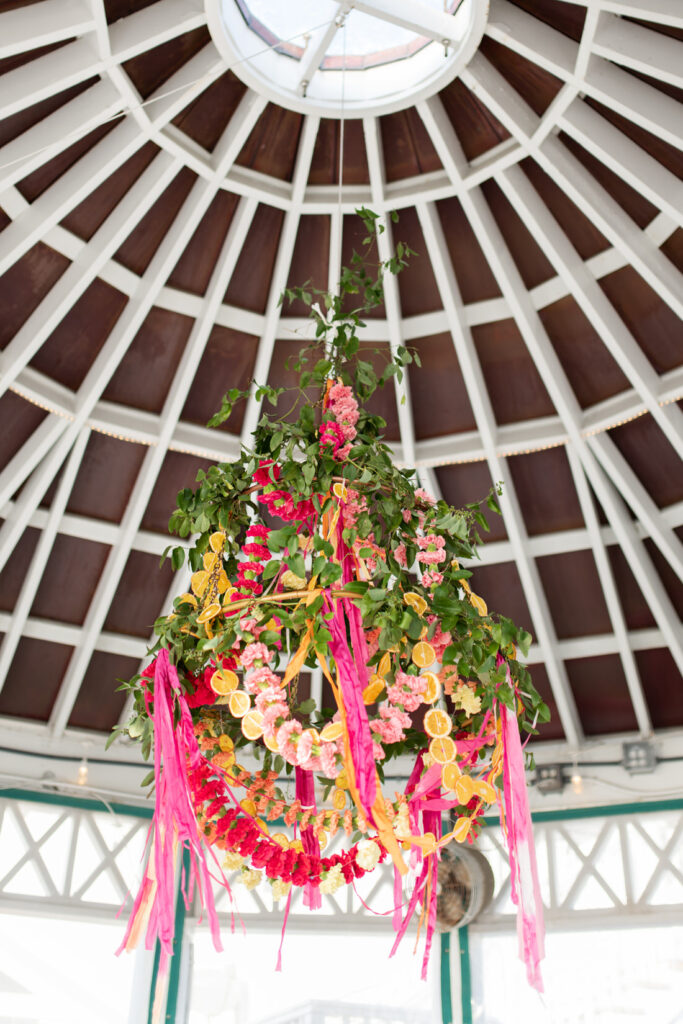 bud and alley's reception colorful boho citrus flower chandelier